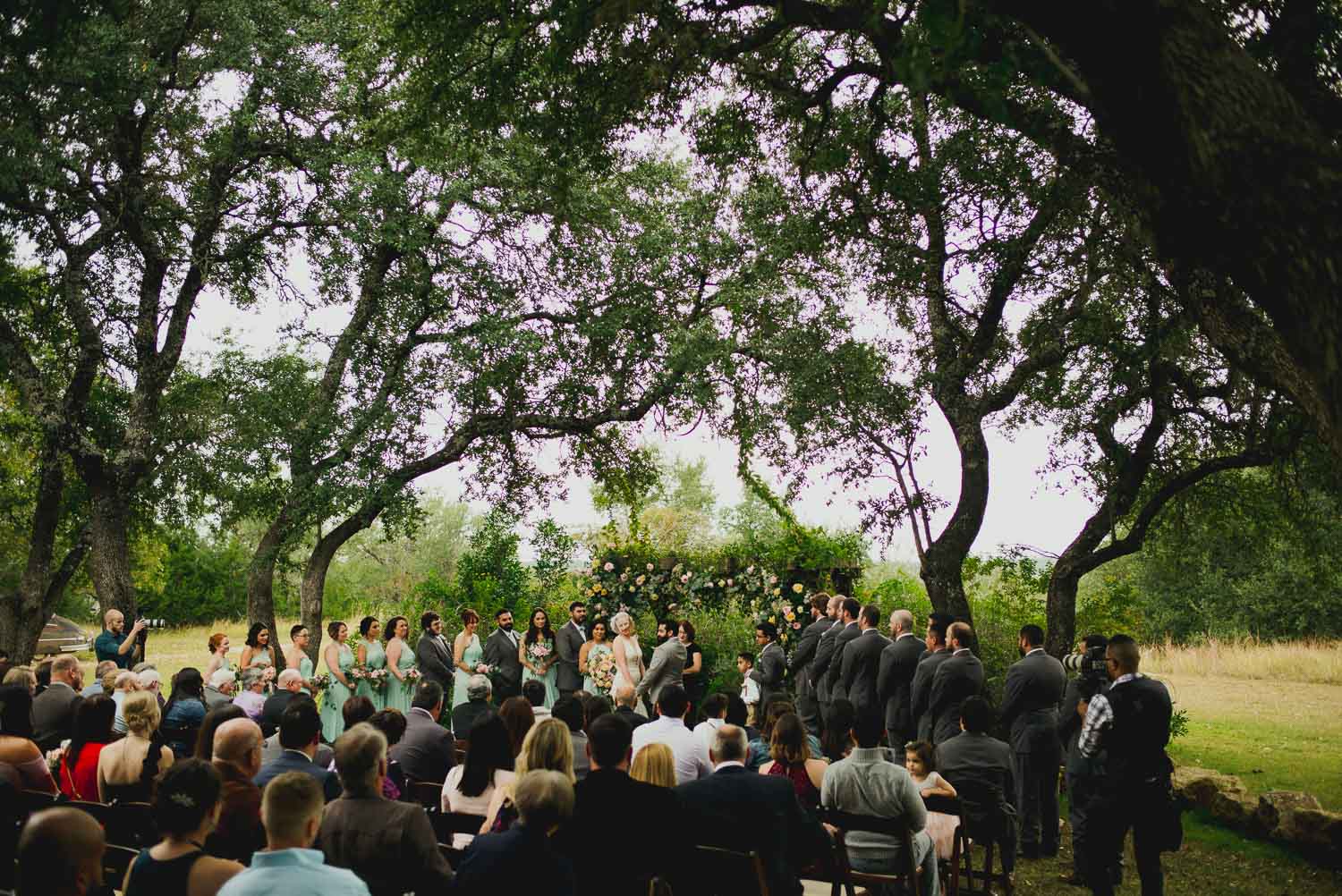 Wide shot of ceremony at RUSTIC BARN WEDDING at VISTA WEST RANCH DRIPPING SPRINGS _ BRANDI + AJ-40