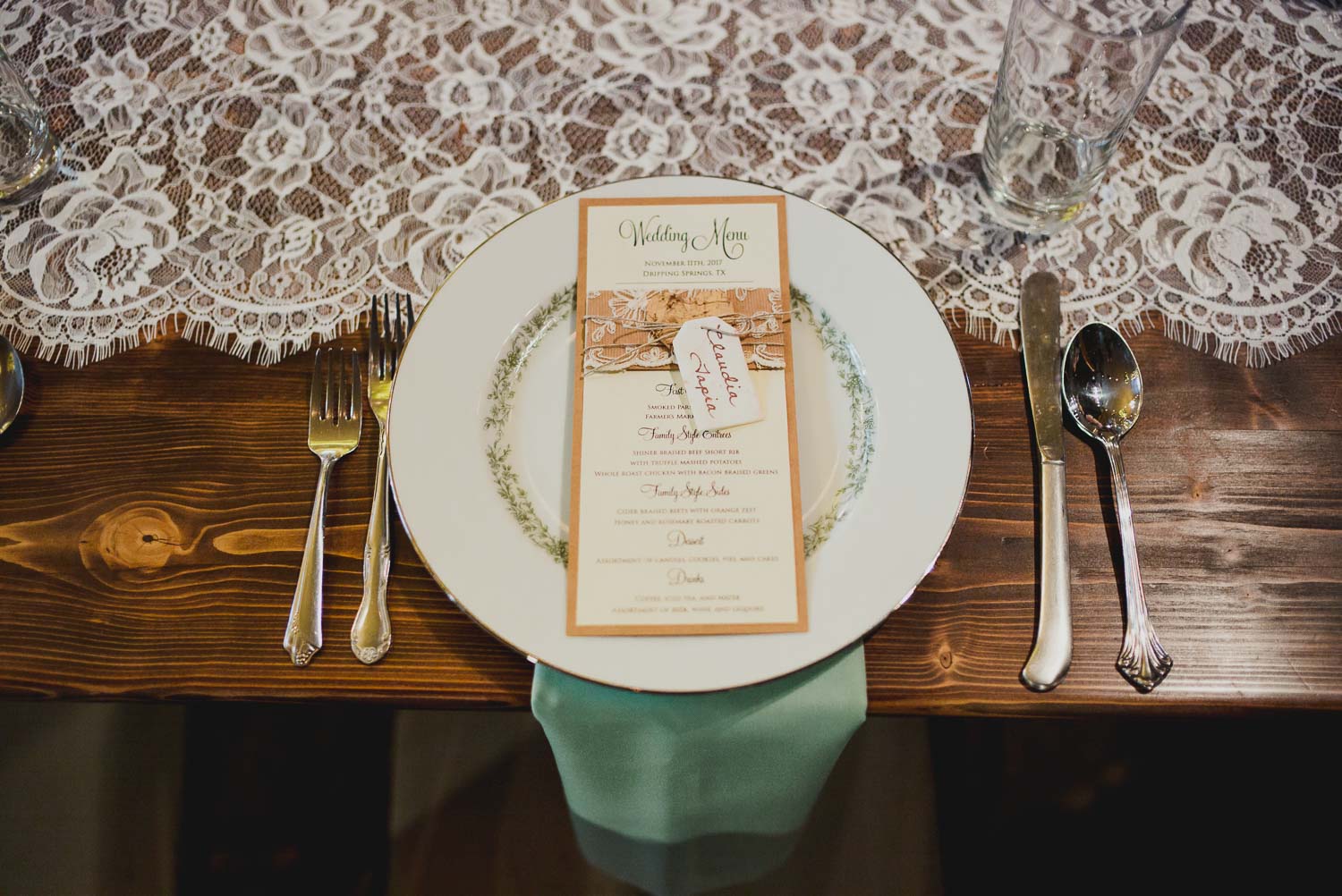 Decor and details show dinner plates and menu RUSTIC BARN WEDDING at VISTA WEST RANCH DRIPPING SPRINGS _ BRANDI + AJ-44