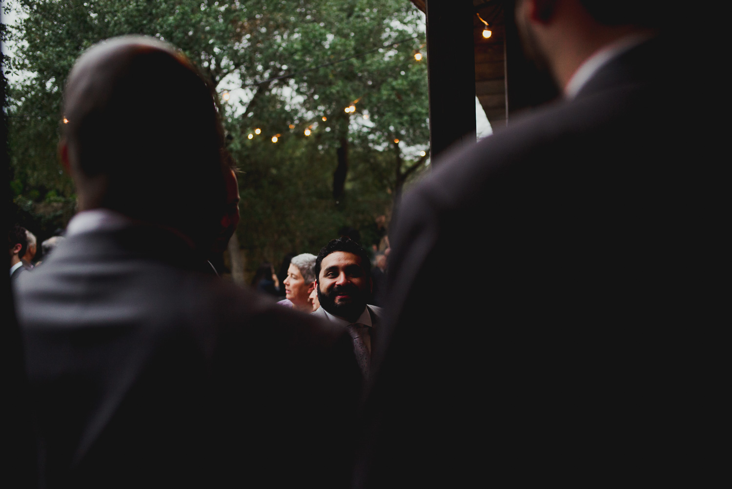 The groom at a cocktail party RUSTIC BARN WEDDING at VISTA WEST RANCH DRIPPING SPRINGS _ BRANDI + AJ-49