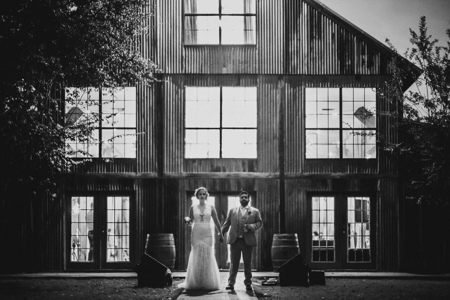 Couple pose outside barn RUSTIC BARN WEDDING at VISTA WEST RANCH DRIPPING SPRINGS _ BRANDI + AJ-58