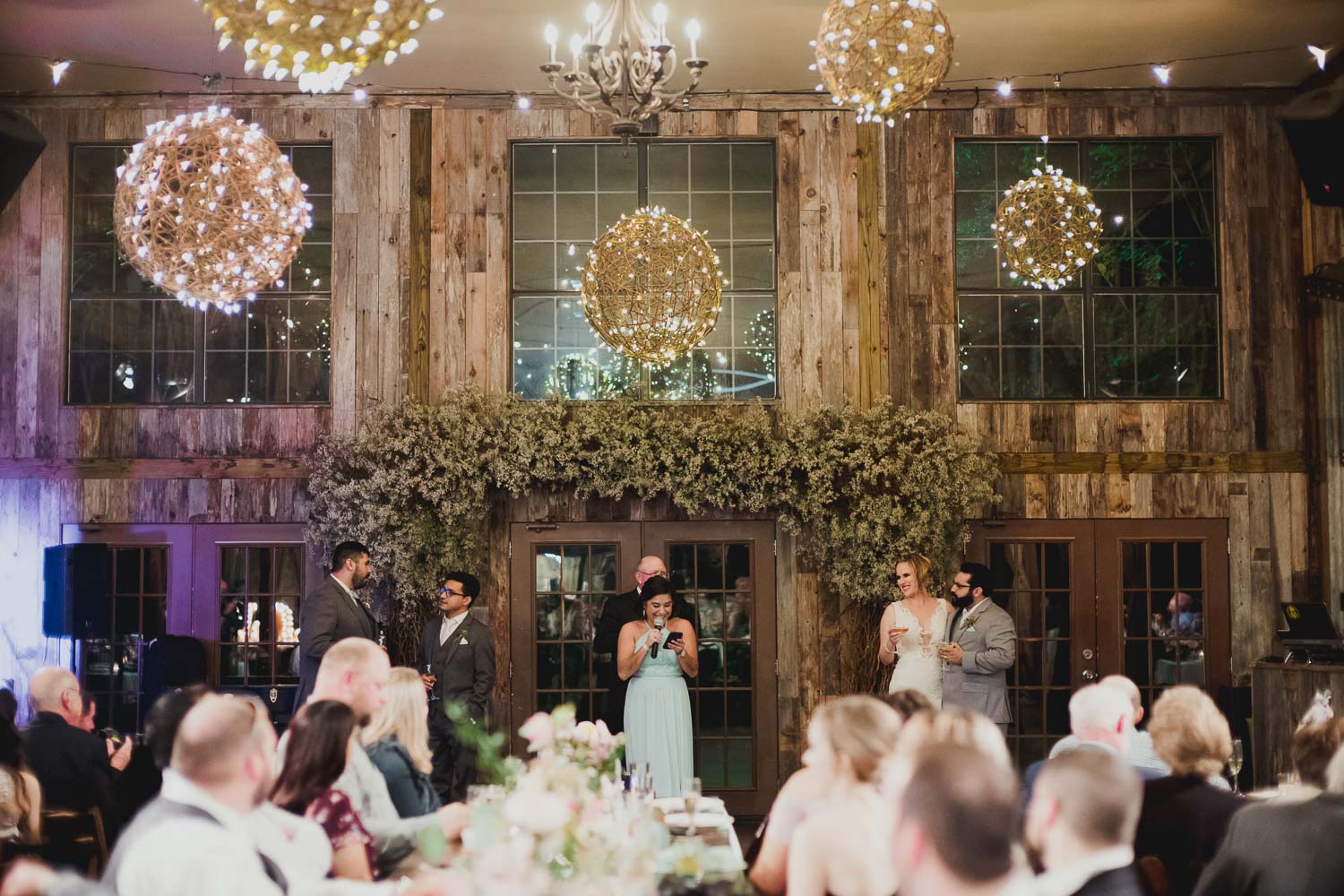 Toasting in the barn RUSTIC BARN WEDDING at VISTA WEST RANCH DRIPPING SPRINGS _ BRANDI + AJ-61