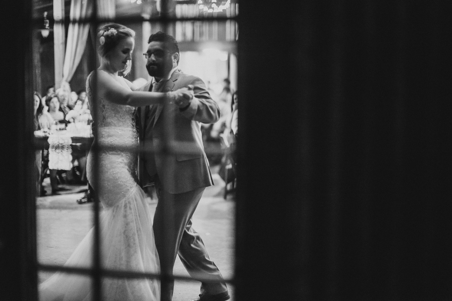 Couples first dance through window of barn at RUSTIC BARN WEDDING at VISTA WEST RANCH DRIPPING SPRINGS _ BRANDI + AJ-62