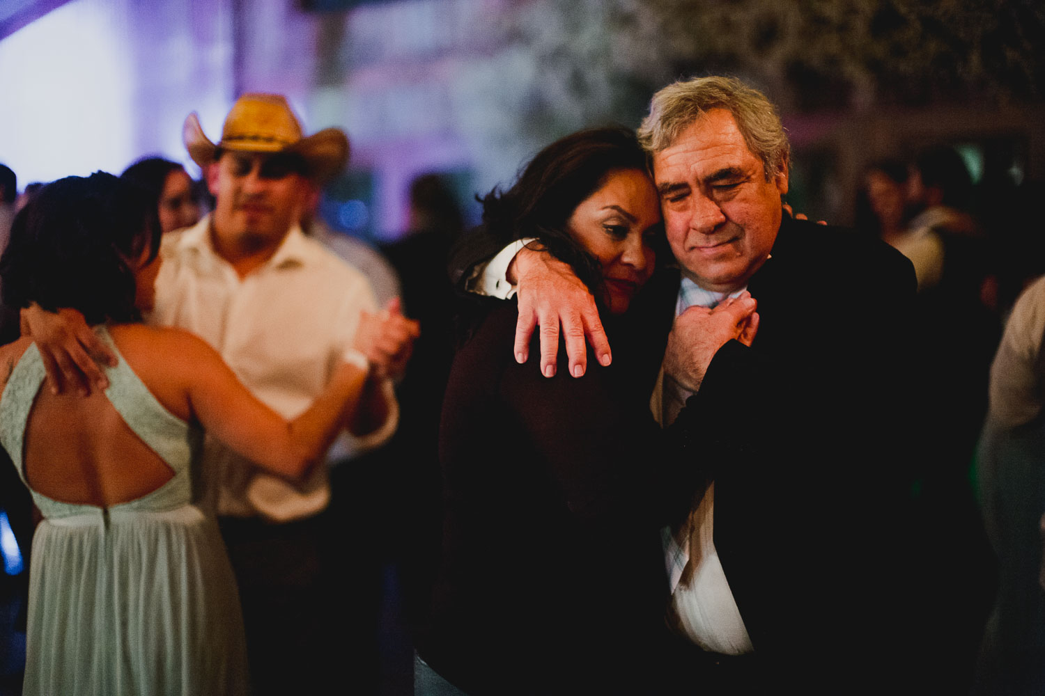 Mother and father of the groom slow dance at RUSTIC BARN WEDDING at VISTA WEST RANCH DRIPPING SPRINGS _ BRANDI + AJ-74