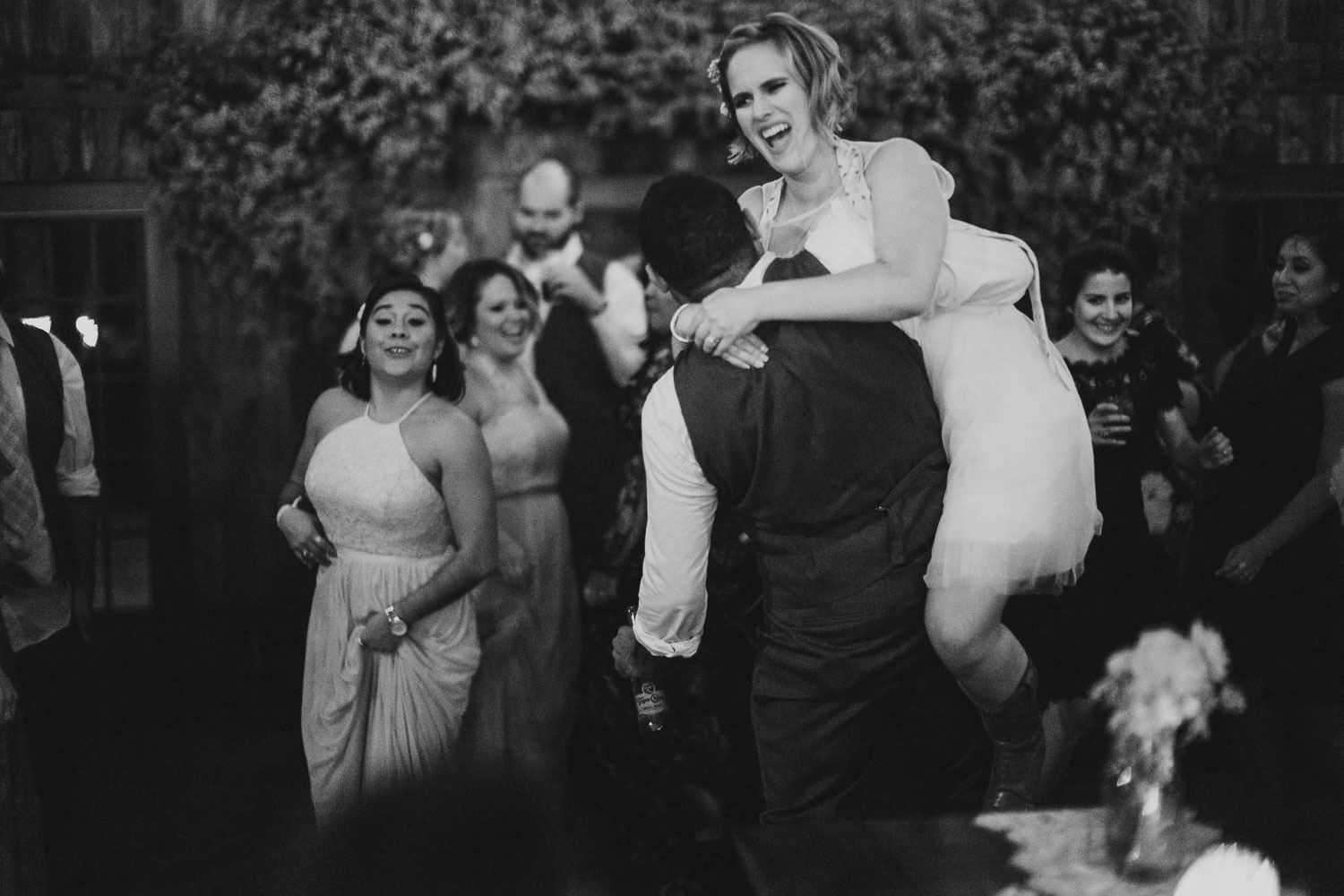 Bride jumps on friends back RUSTIC BARN WEDDING at VISTA WEST RANCH DRIPPING SPRINGS _ BRANDI + AJ-78