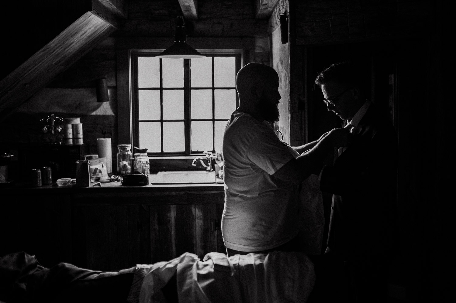 Groom readies in the cottage upstairs at the wedding location in Bulverde, Texas