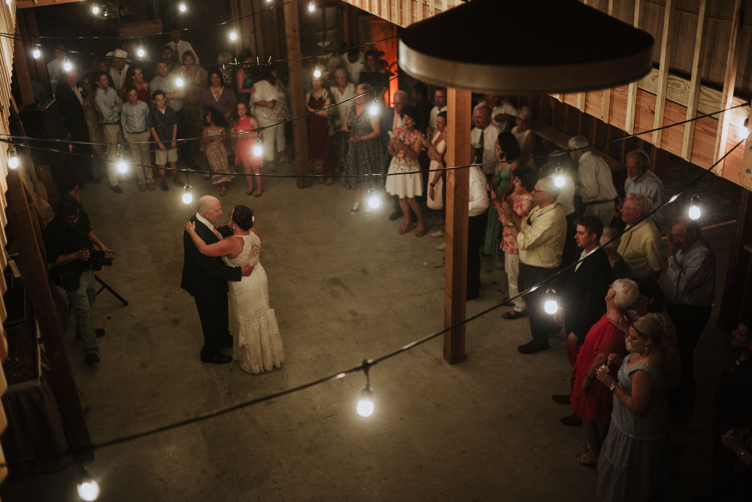 Father and daughters first dance at a barn wedding reception, Bulverde, Texas