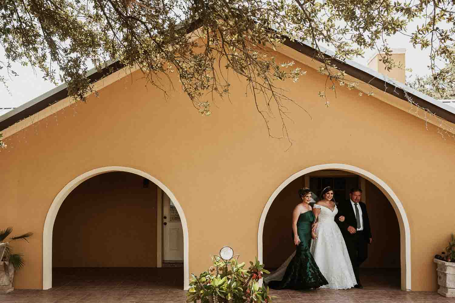 Parents with the bride leave the family home