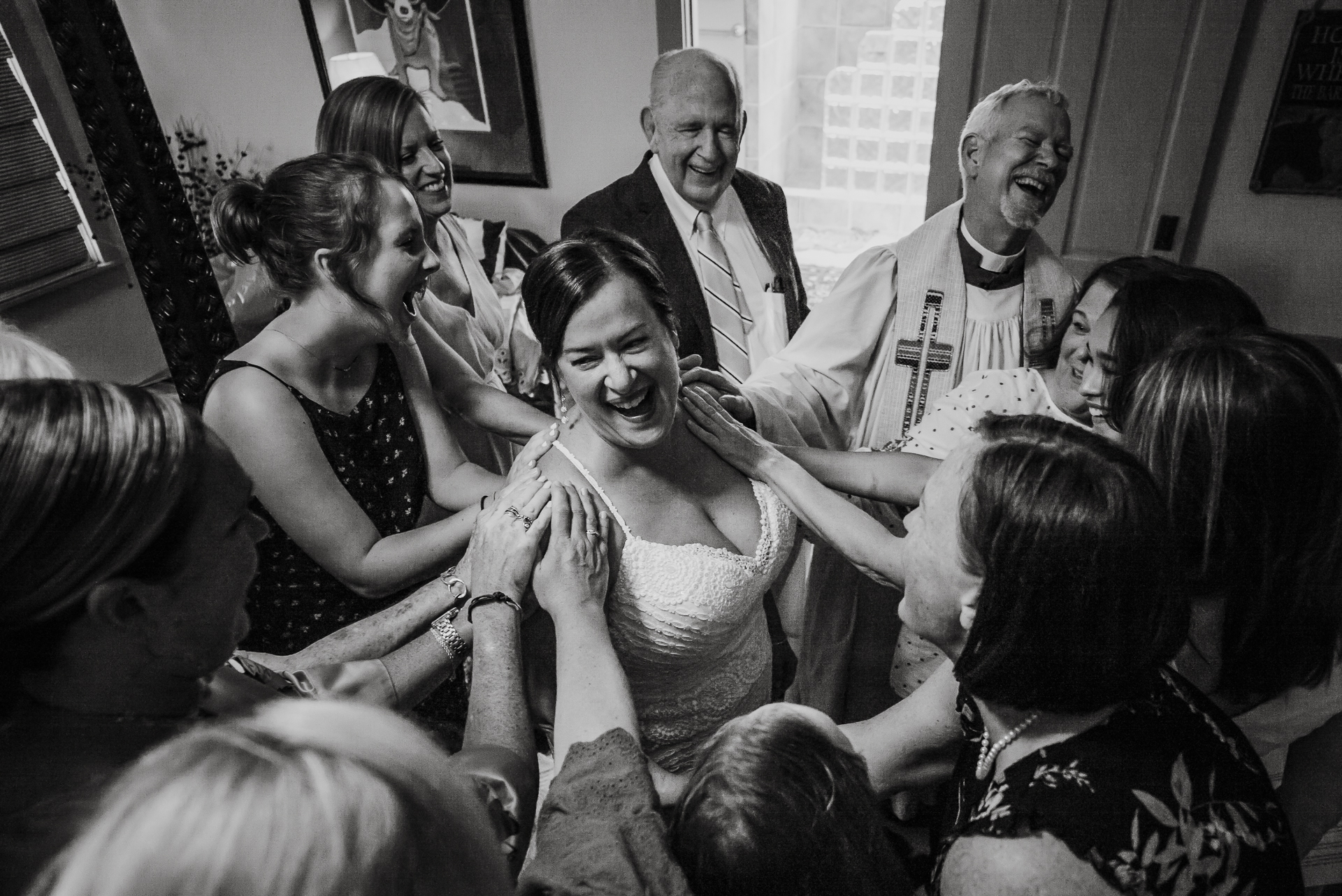 WPJA Bride surrounded by friends and family in a prayer