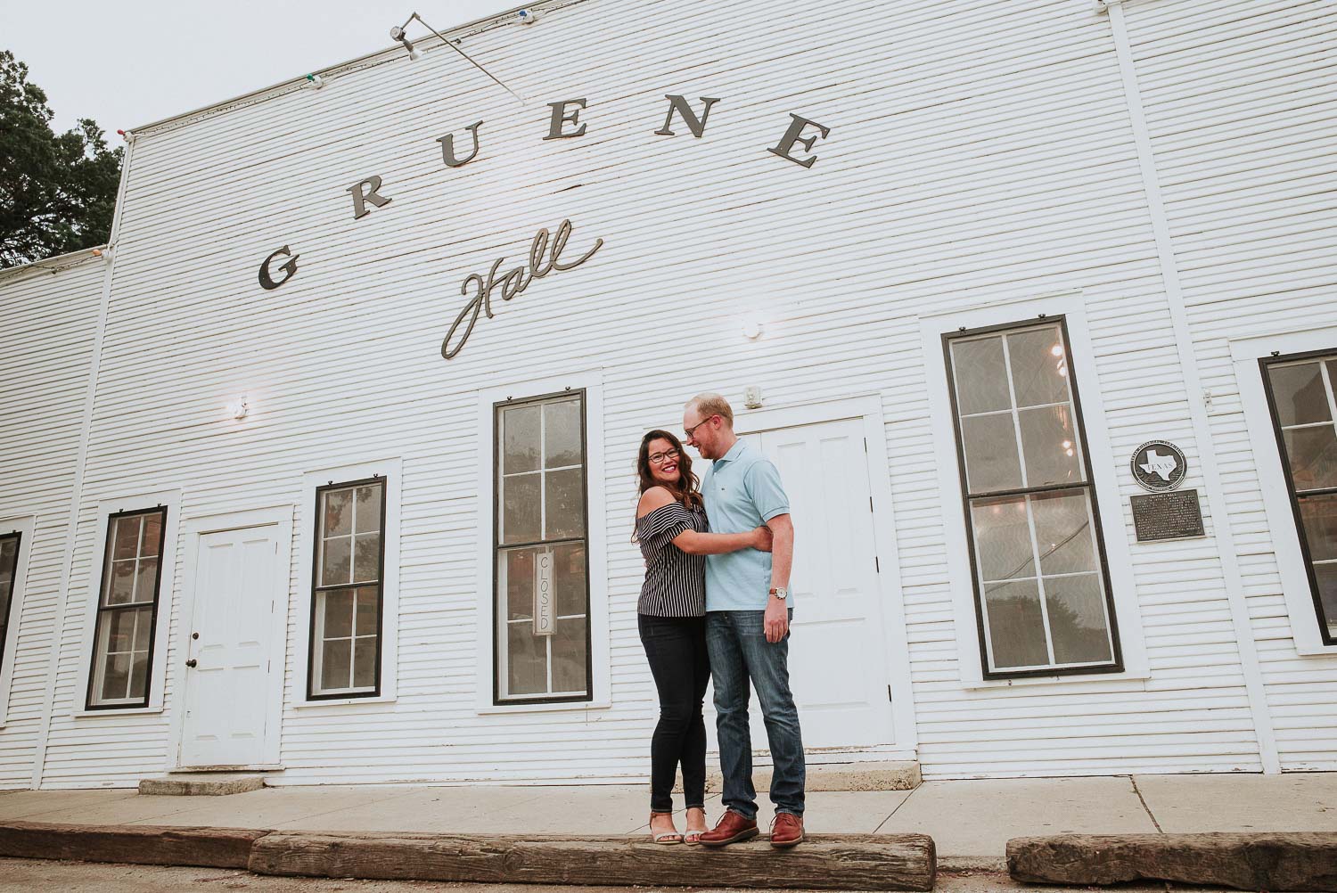 Andrea and Alex engagement session outside Gruene Hall Dance hall built in the 19th century hosting live country, Americana & blues musicians nightly.