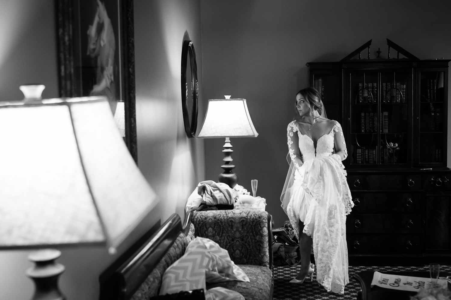 Stephanie the bride on her wedding day checks the mirror one last time before departing the Menger Hotel Wedding Ceremony San Antonio Reception Grand BallroomSan Antonio -Leica photographer-Philip Thomas Photography