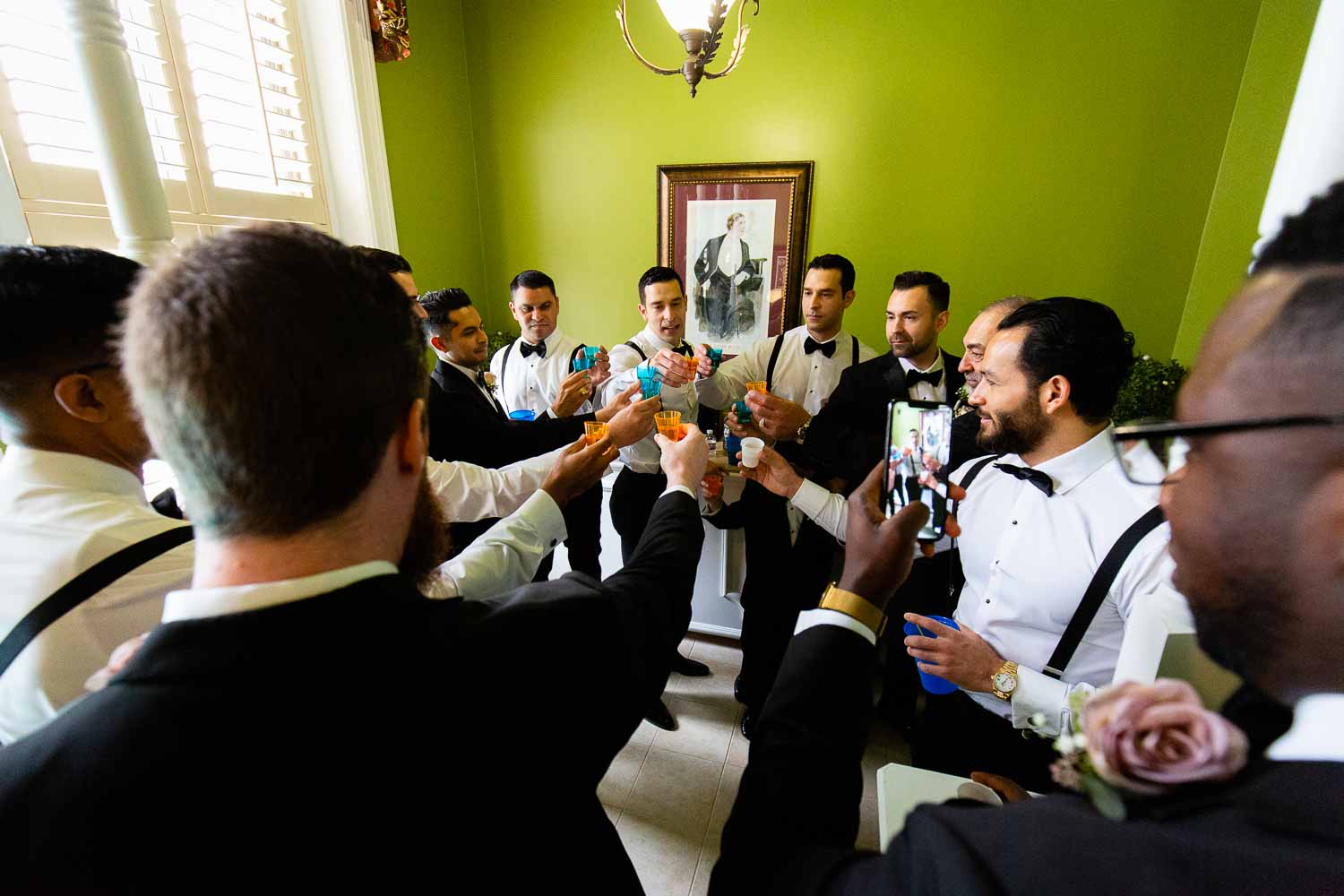 The groom and groomsmen toast in hotel room at the Menger Hotel Wedding Ceremony San Antonio Reception Grand BallroomSan Antonio -Leica photographer-Philip Thomas Photography