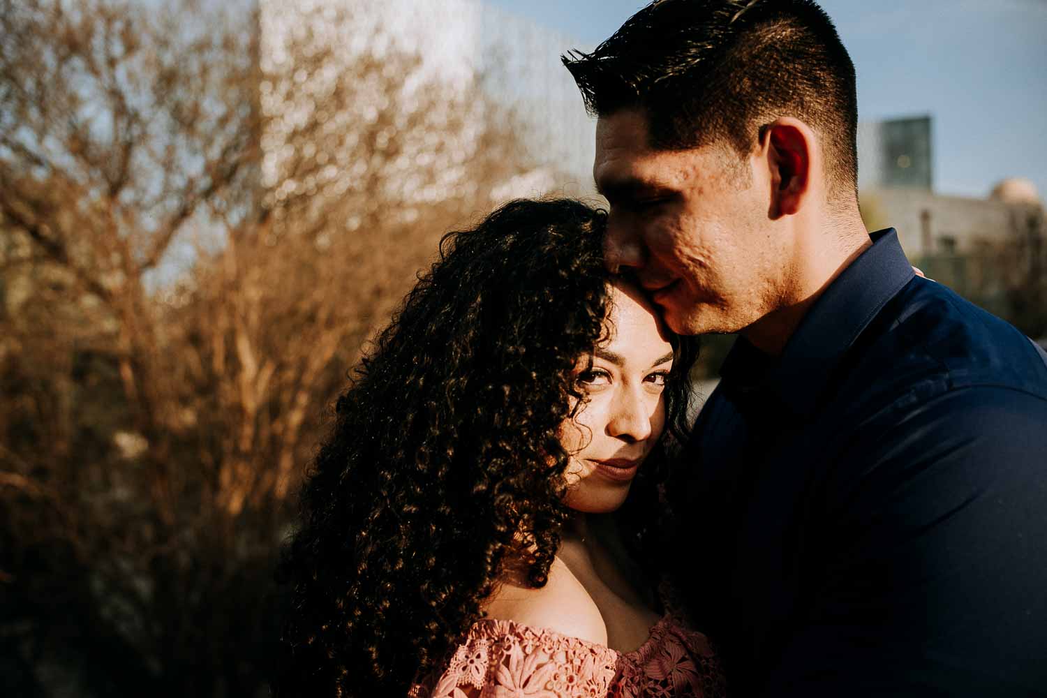 Couple on riverwalk along Hotel Havana Downtown San Antonio Engagement Pictures at nightime Commerce and Houston Street Majestic