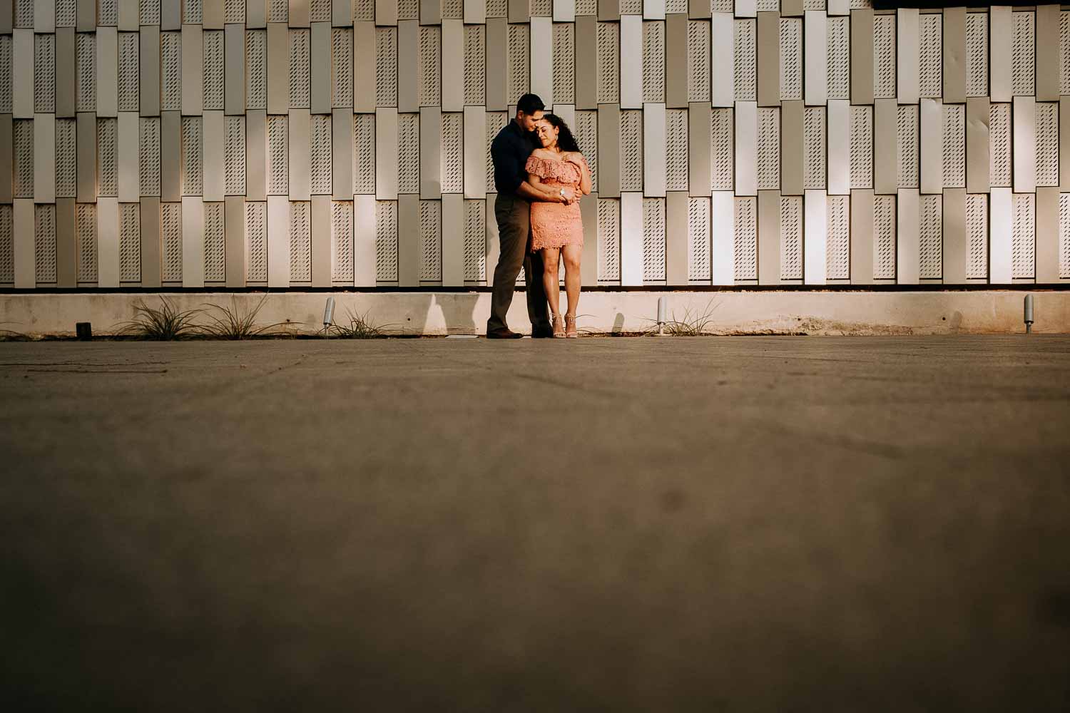 Couple on riverwalk along Hotel Havana Downtown San Antonio Engagement Pictures at nightime Commerce and Houston Street Tobin Center