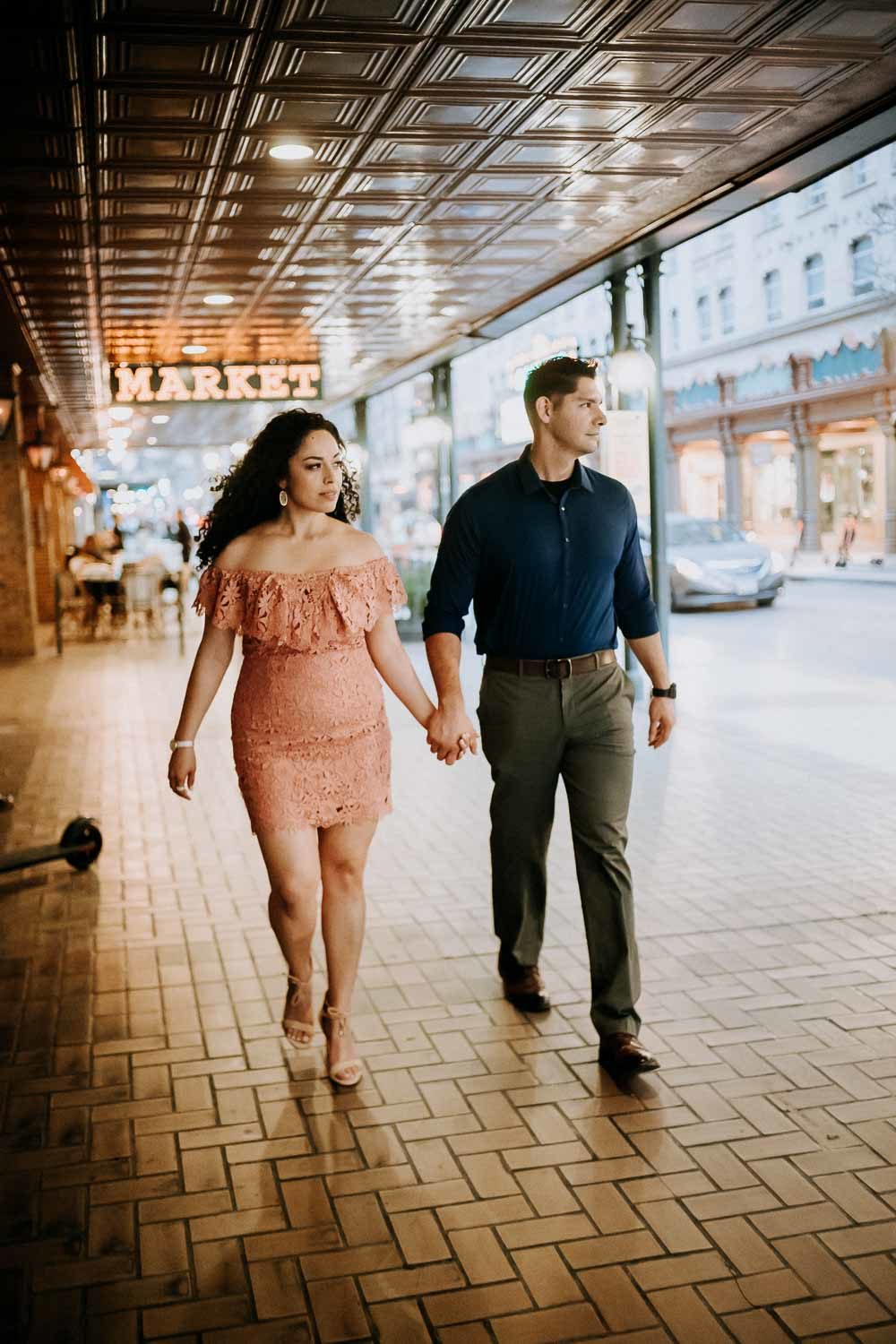 Couple on riverwalk along Hotel Havana Downtown San Antonio Engagement Pictures at Havana Hotel downstairs bar night time Commerce and Houston Street Majestic on Houston Street
