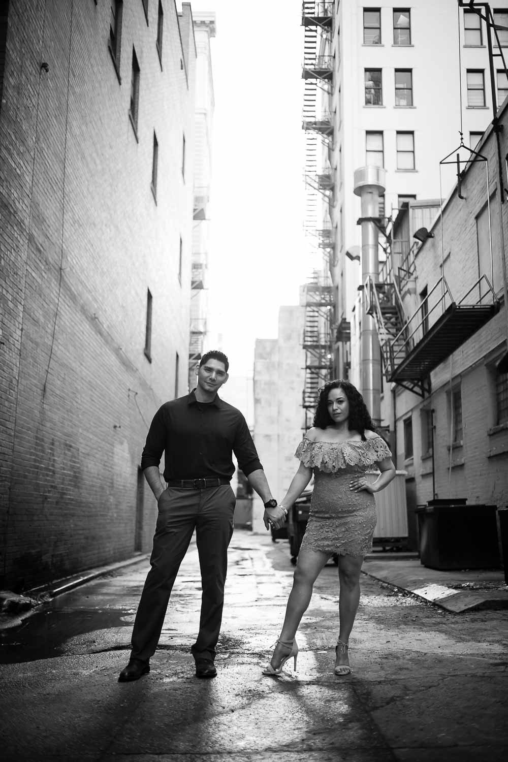 Alleyway shoot Couple on riverwalk along Hotel Havana Downtown San Antonio Engagement Pictures at nightime Commerce and Houston Street Majestic