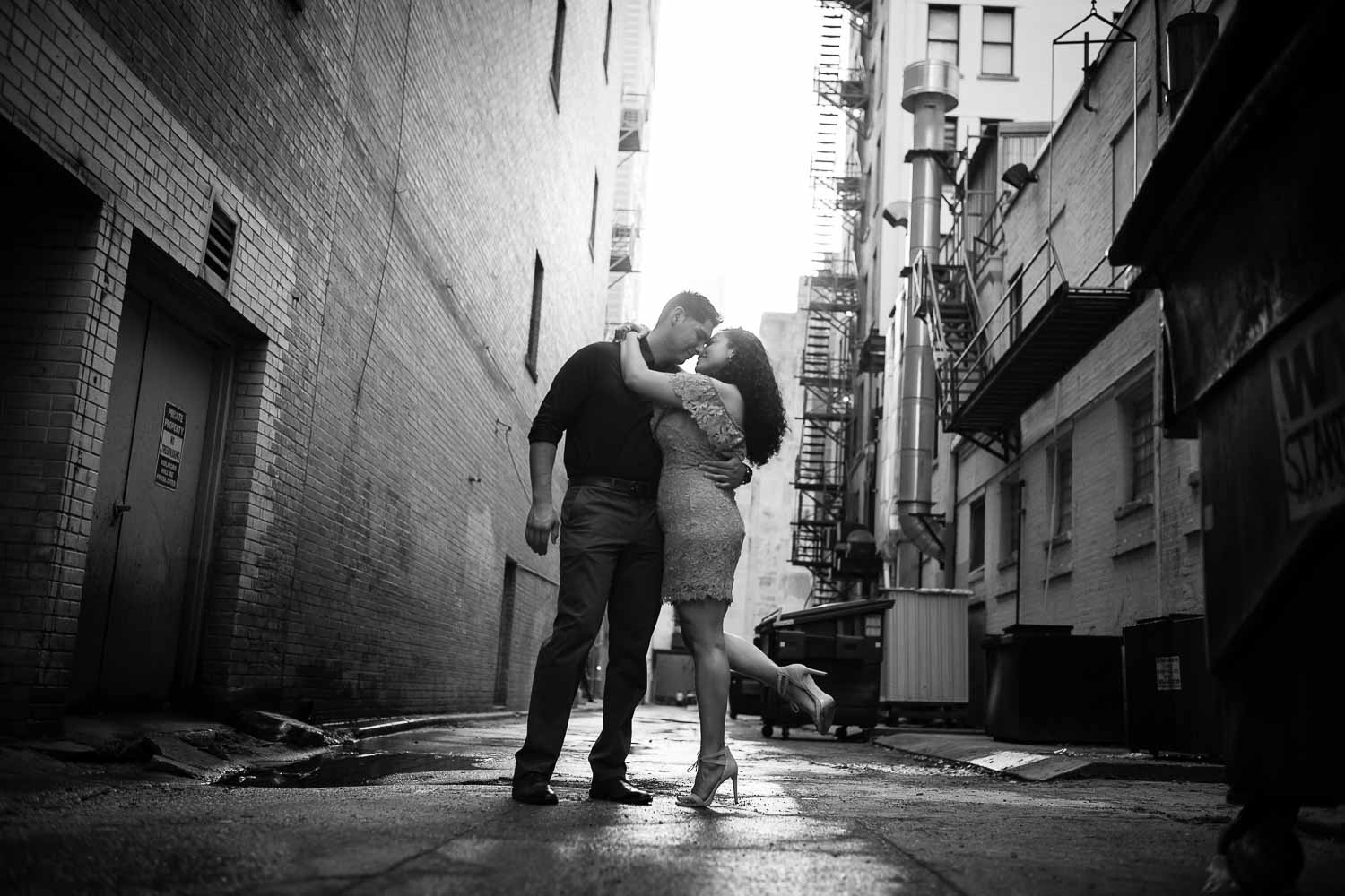 Alleyway shoot Couple on riverwalk along Hotel Havana Downtown San Antonio Engagement Pictures at nightime Commerce and Houston Street Majestic