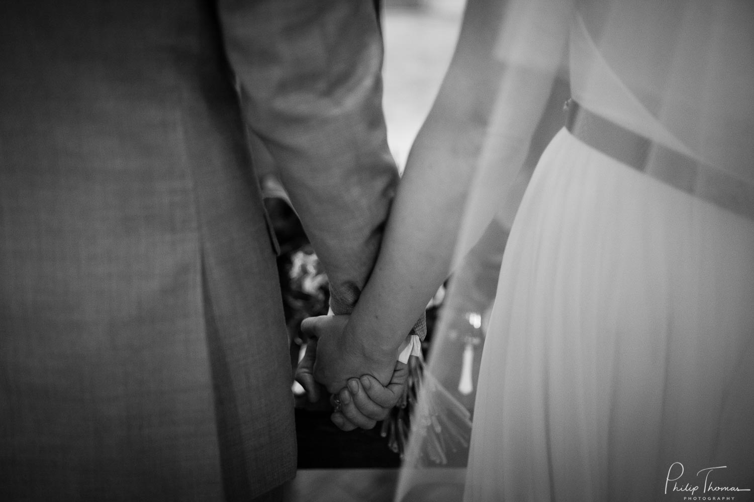 Couple hold hands at The Grand Texana Wedding Barr Minta + Phillip -
