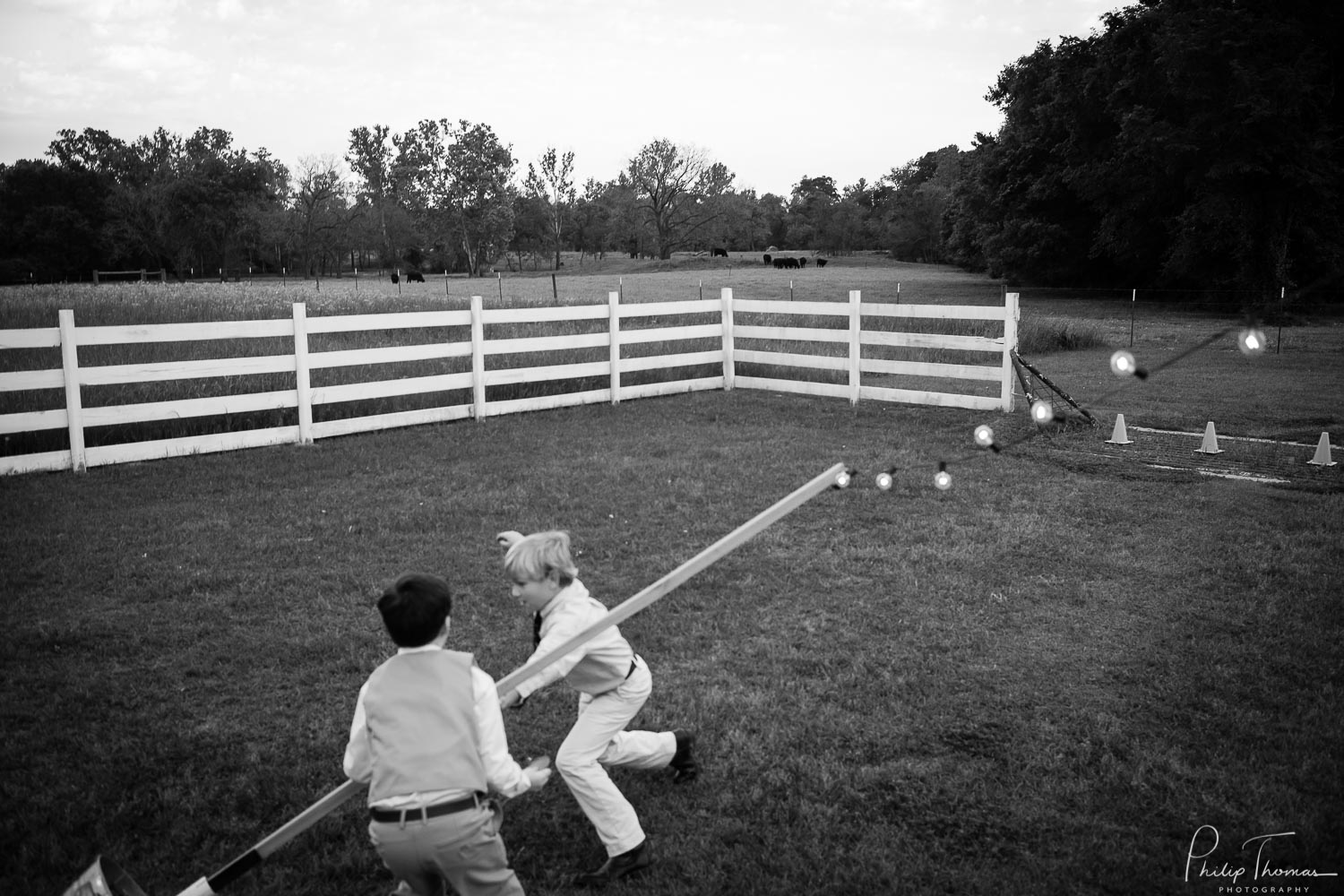 Kids play at back of the The Grand Texana Wedding Barr Minta + Phillip -