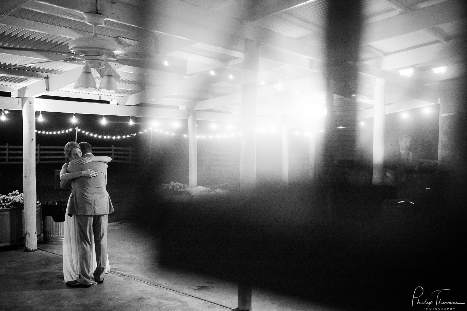 Last dance shot through a light at The Grand Texana Wedding Barr Minta + Phillip -