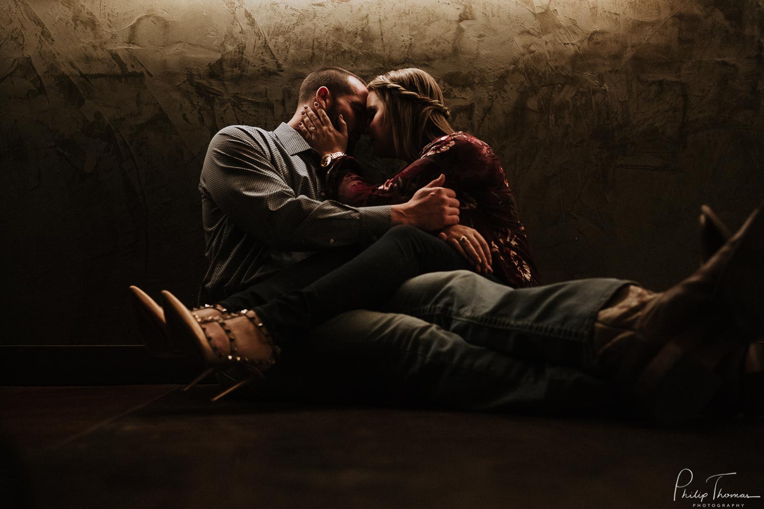 Couple snuggle during an engagement shoot at the JW Marriott Hill Country San Antonio Texas WPJA Diamond Award Winning Image - JW Marriott San Antonio Hill Country Resort Engagement photos - Philip Thomas Photography