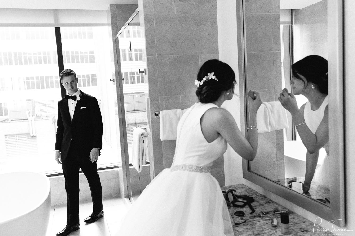 A newly married couple enjoy a break in-between the ceremony and cocktail party at the JW downtown Houston, Texas. Intermission
