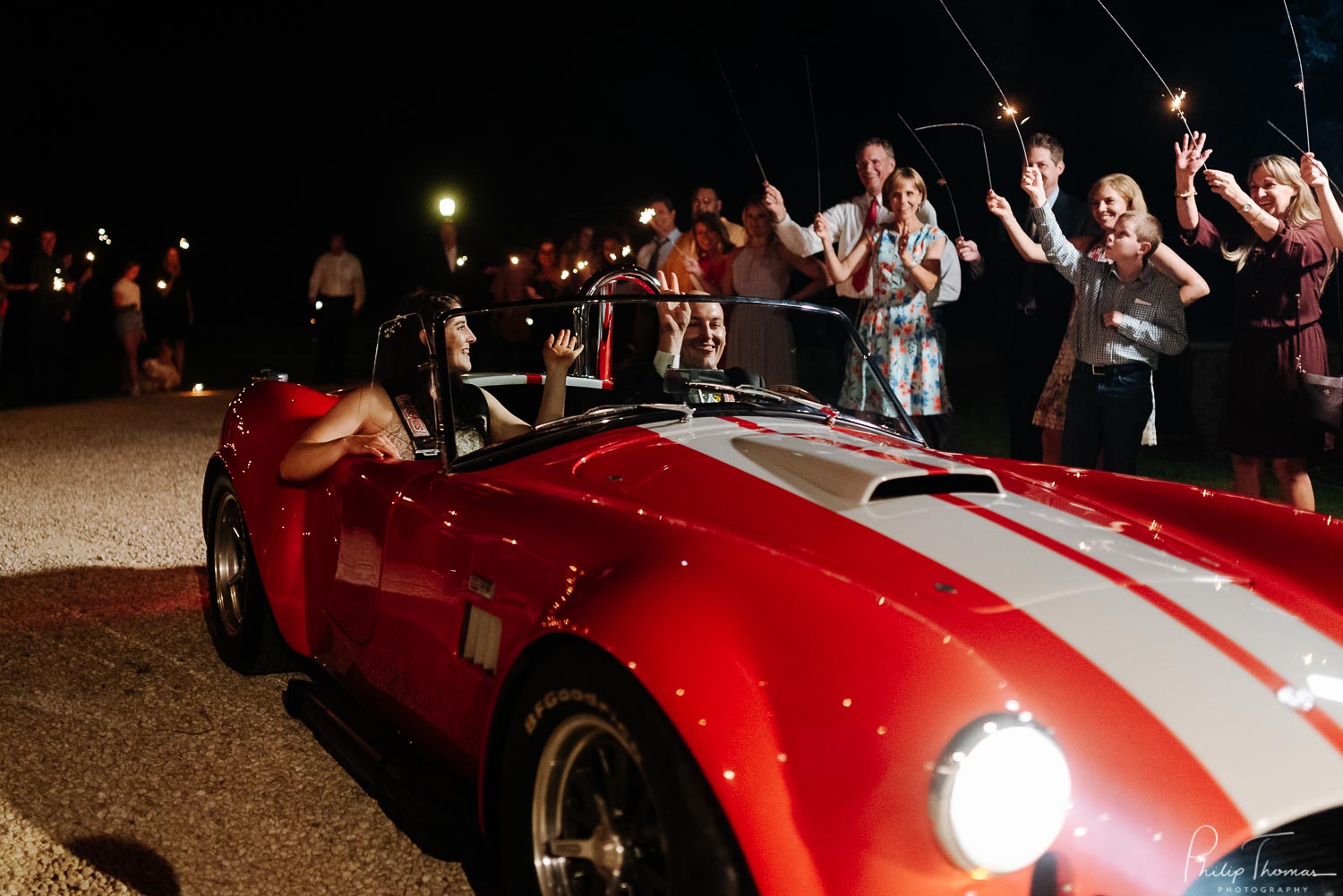 Just married couple leave in a vintage sports car from The Milestone Boerne Wedding ceremony and reception - Hailey and Hunter-Leica photographer-Philip Thomas Photography