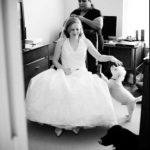 Award winning WPJA and ISPWP images. The bride sits with her two dogs.