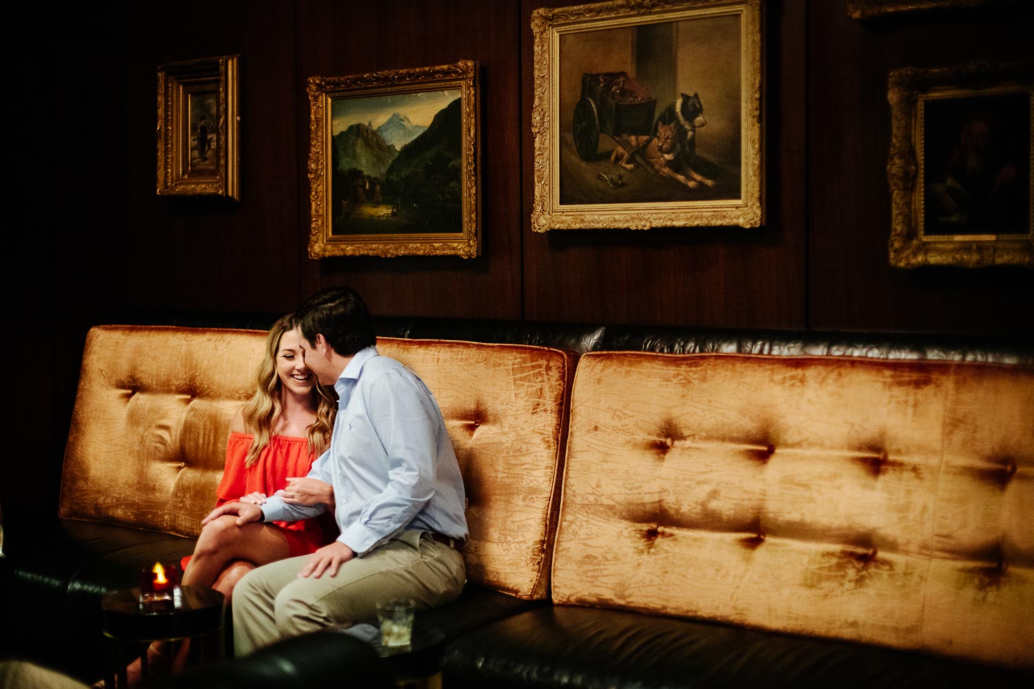 Alison Connor snuggling in a cozy bar at St. Anthony Hotel Engagement Downtown San Antonio - Philip Thomas Photography