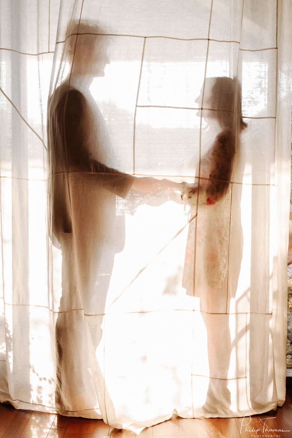 Silhouetted behind white see through curtains at South Congress Hotel-Leica photographer-Philip Thomas Photography