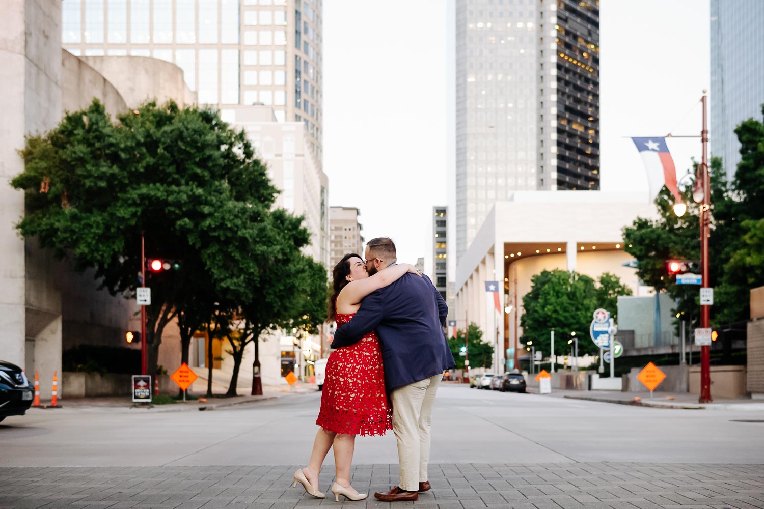 Crossing the street at Luci and Bryans engagement session downtown Theater District Houston Texas-Philip Thomas Photography