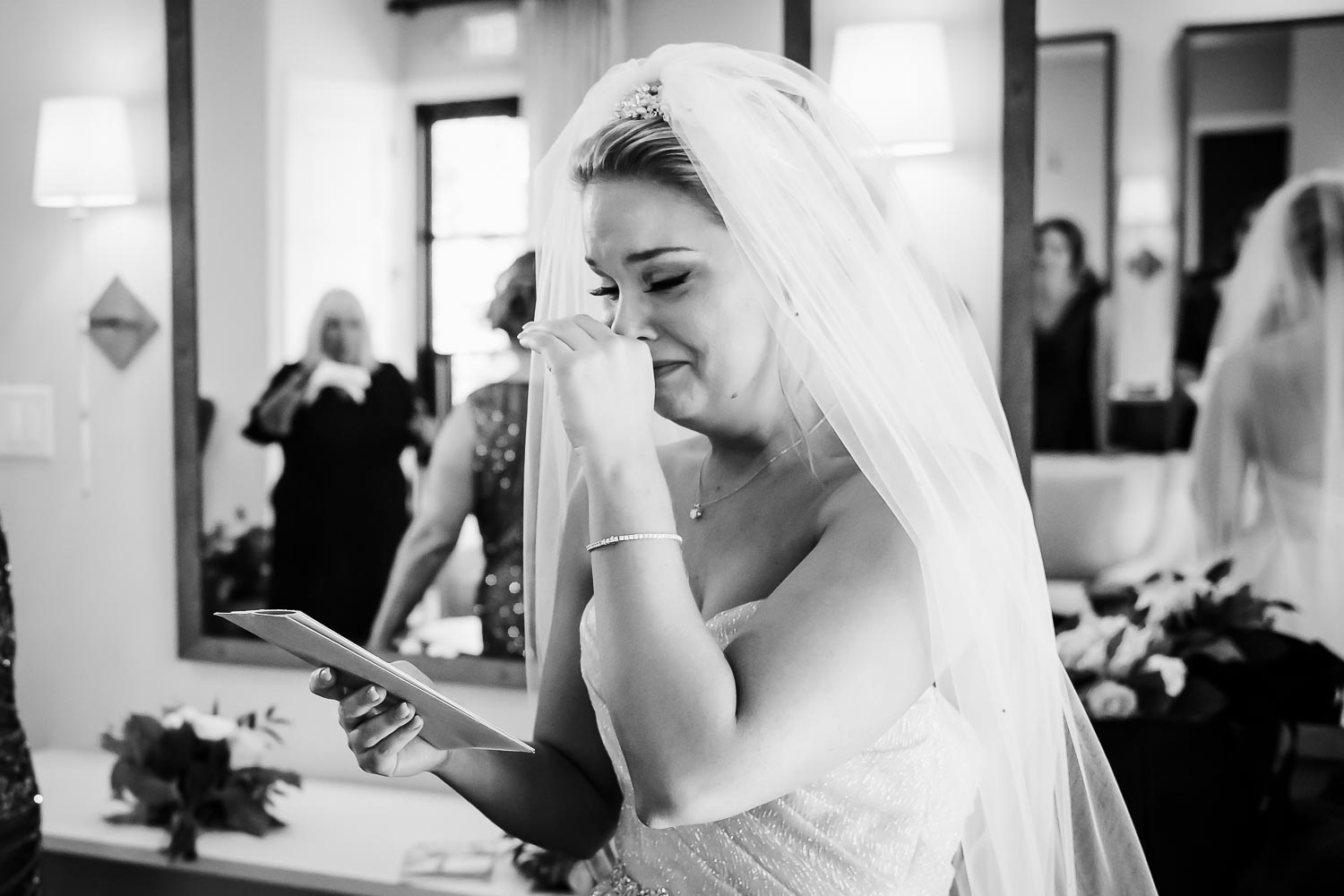 Beautiful bride tears up as she reads a love letter from her husband-to-be at Hayes Hollow Hidden Falls 