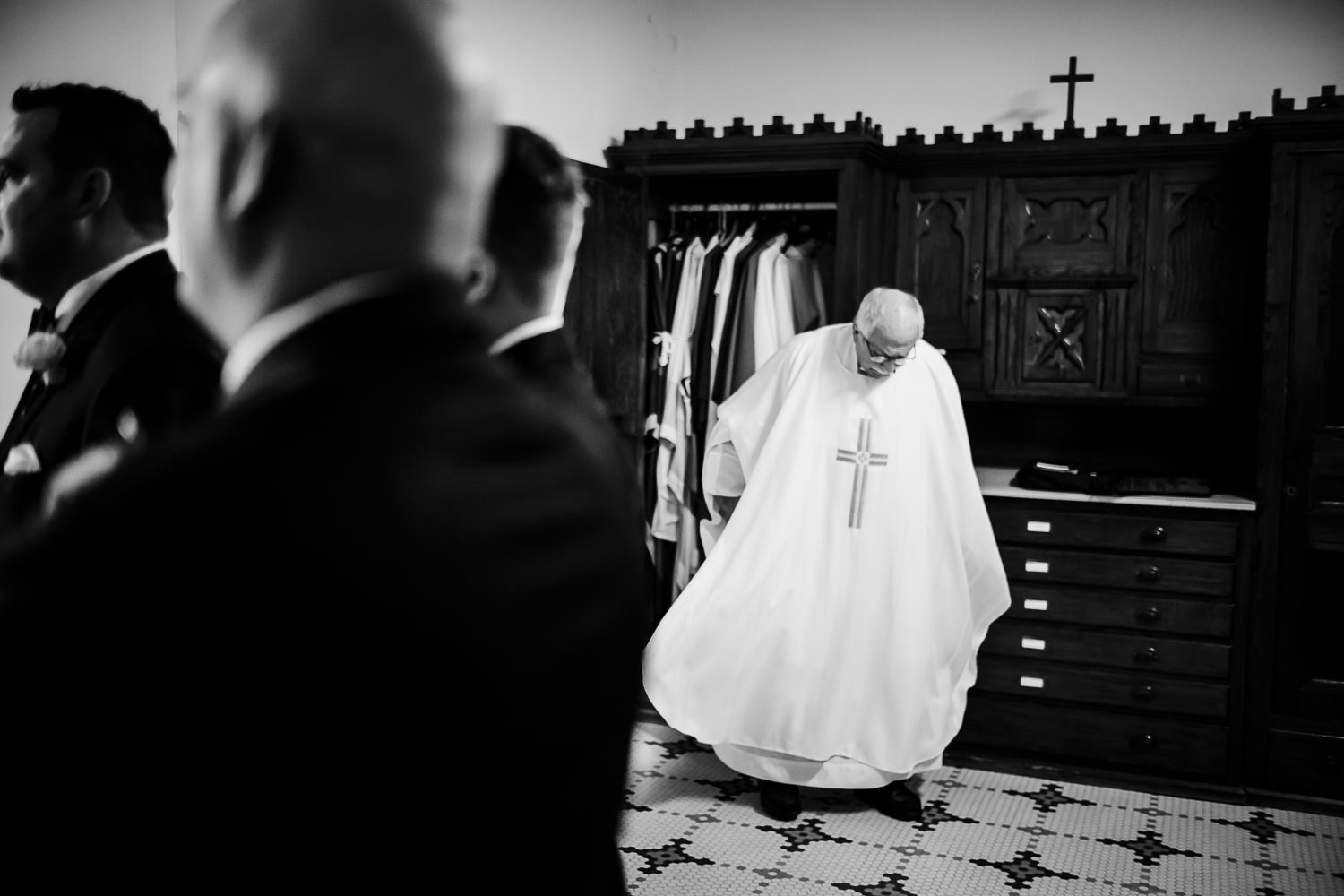 A priest checks his vestment moments before a wedding ceremony at Sacred Heart Chapel San antonio, Texas