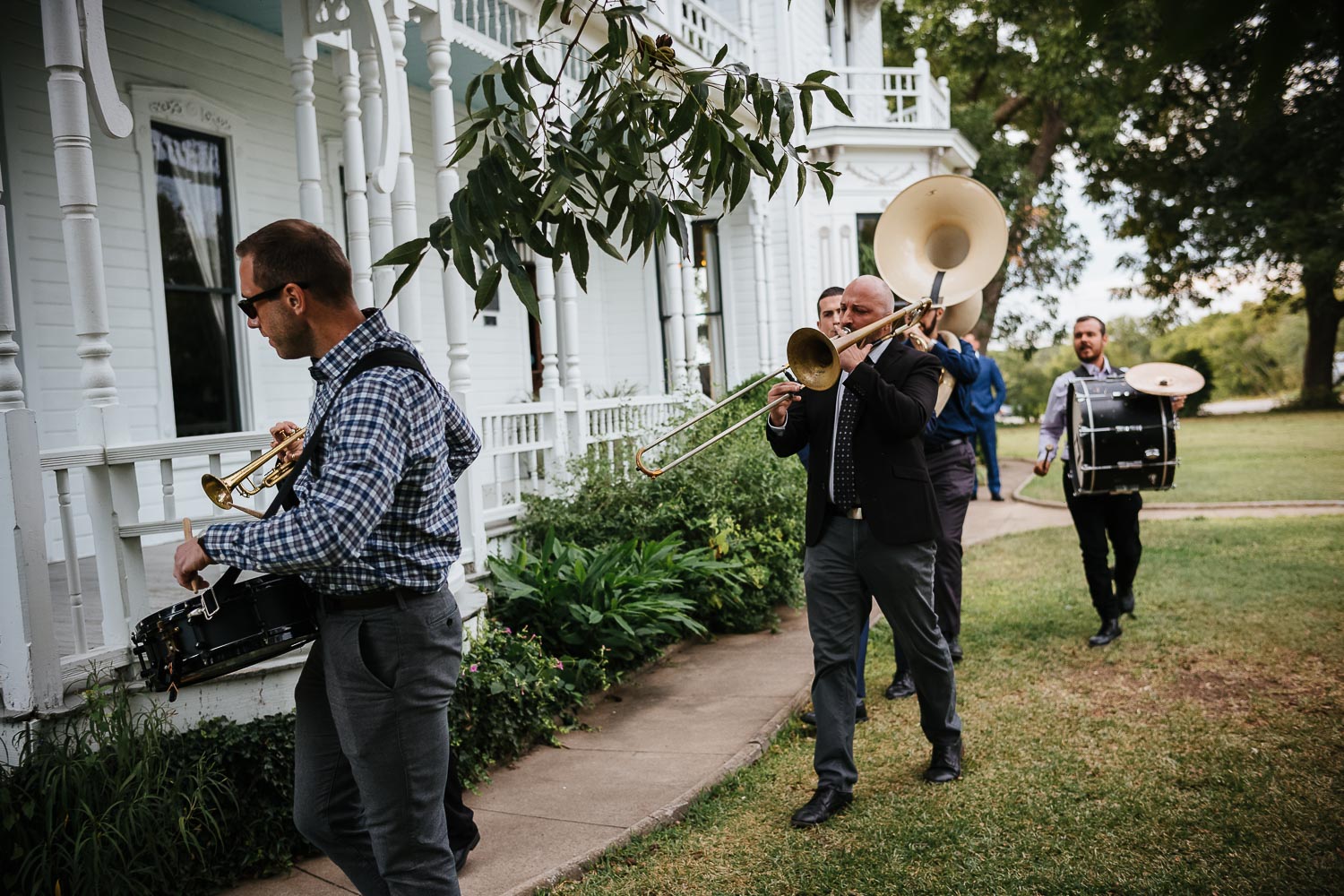 A New Orleans band plays as the wedding ceremony ends at Barr Mansion, Texas