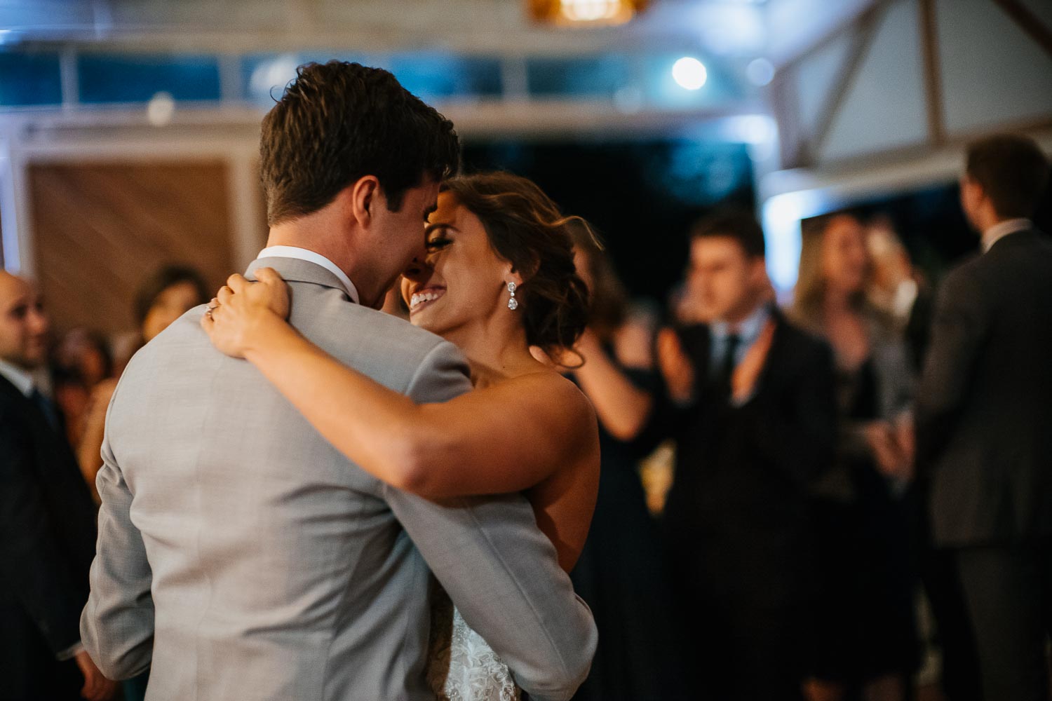 Lovely light captures couple in the farmstead building slow dancing with available light on Leica M10-P and Noctilux 50mm at Barr Mansion, Texas