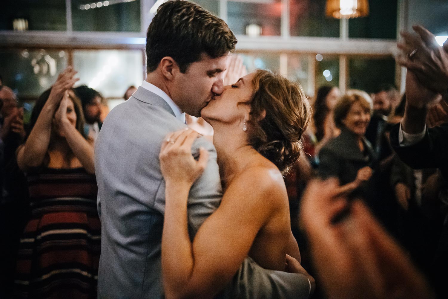 Couple embrace in beautiful low light at Barr Mansion