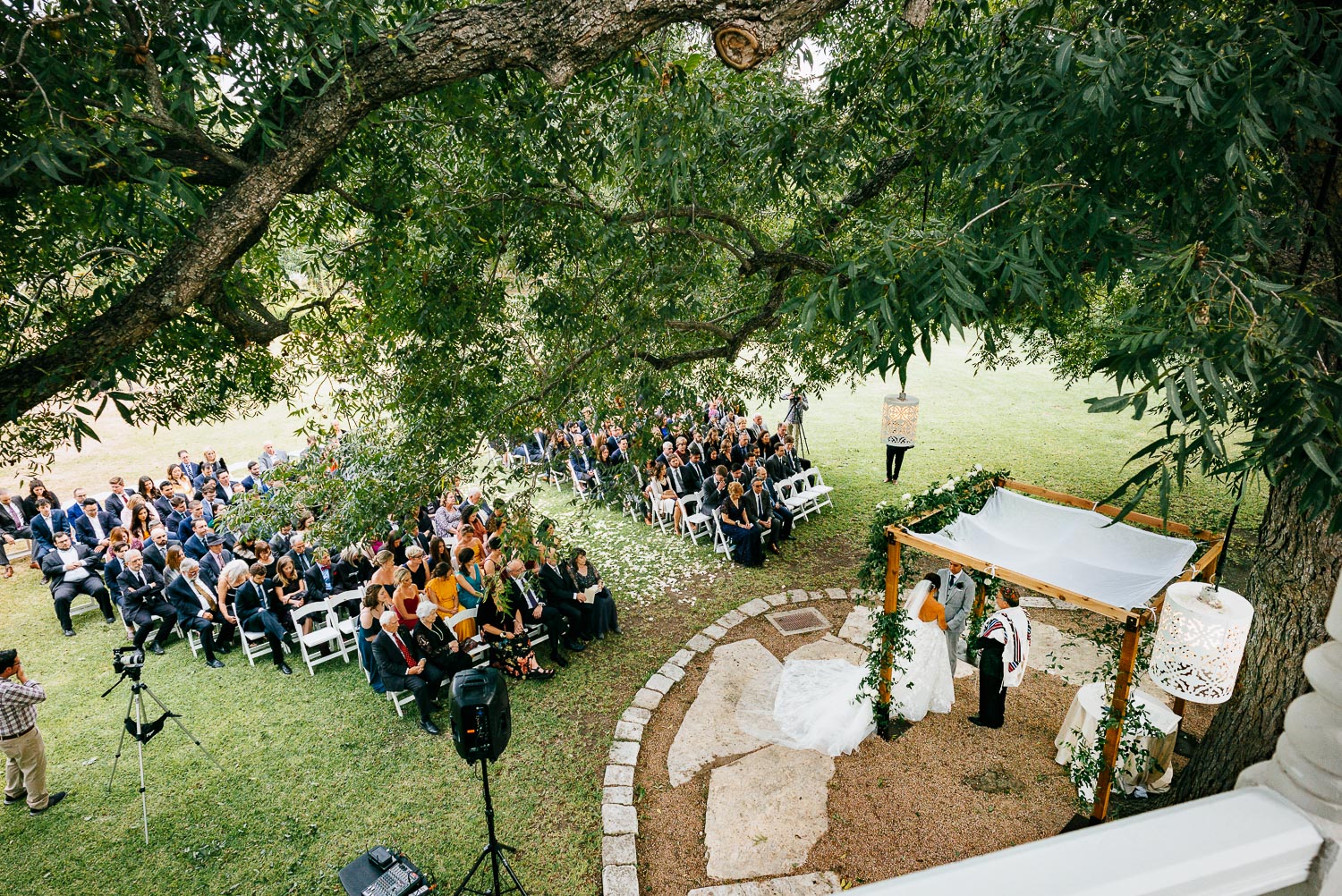 Photo of the wedding ceremony looking down from a balcony at Barr Mansion, Texas