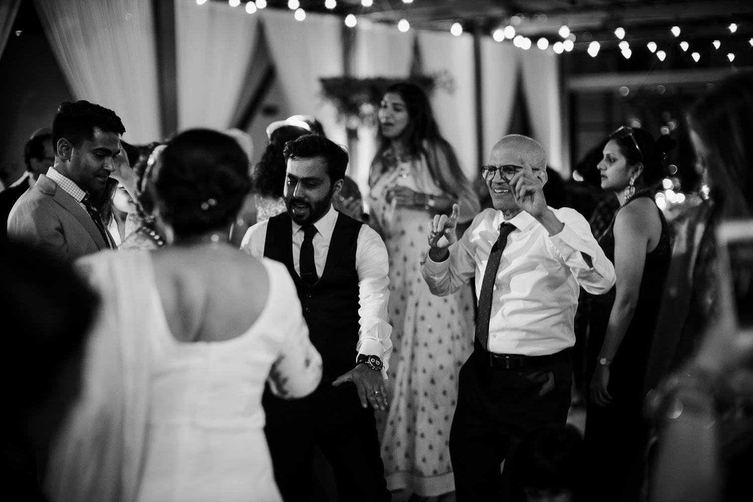 Wedding guests dance during wedding reception