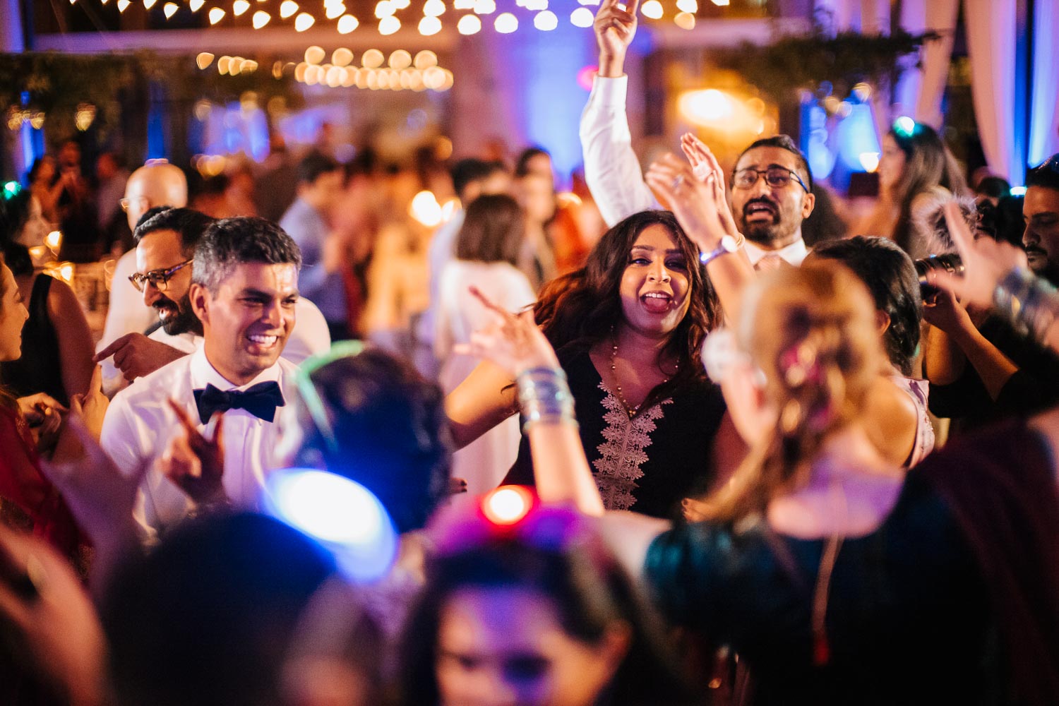 The groom dancing and celebrating at their wedding reception in Austin Texas