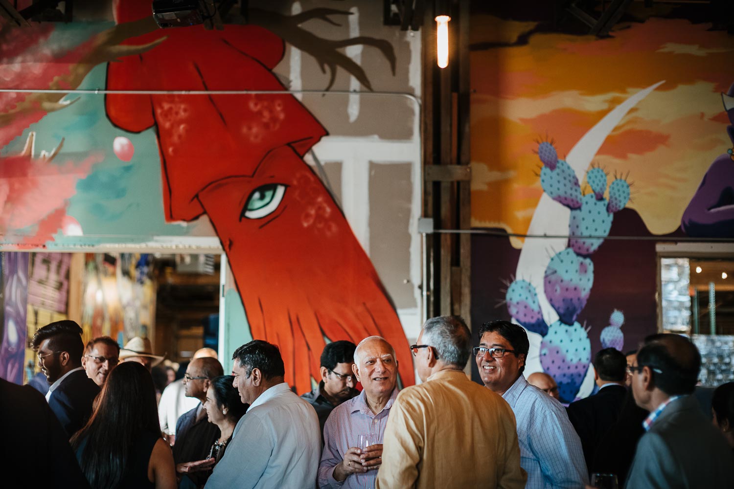 An awesome rehearsal dinner guests with backgrounds showing at The Infinite Monkey Theorem