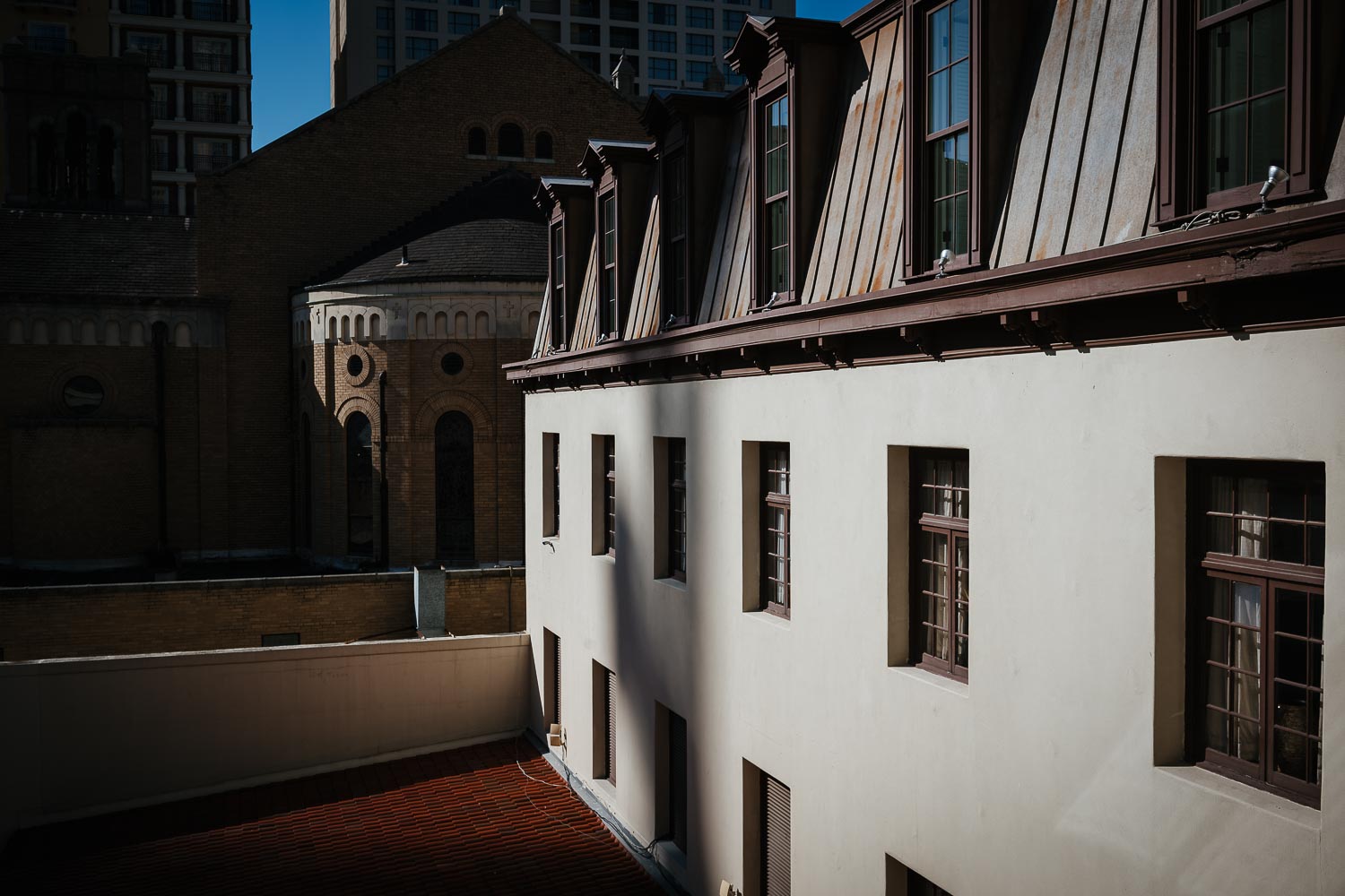 Long shadows are cast on a fall day winter 2019 at Omni La Mansion Riverwalk hotel in San Antonio Texas