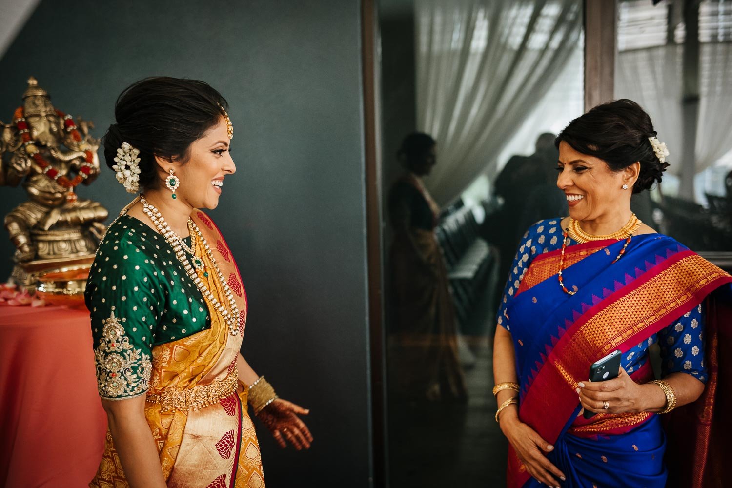 Mother of the bride greets her daughter at Brazos Hall Austin South Hindu asian wedding ceremony