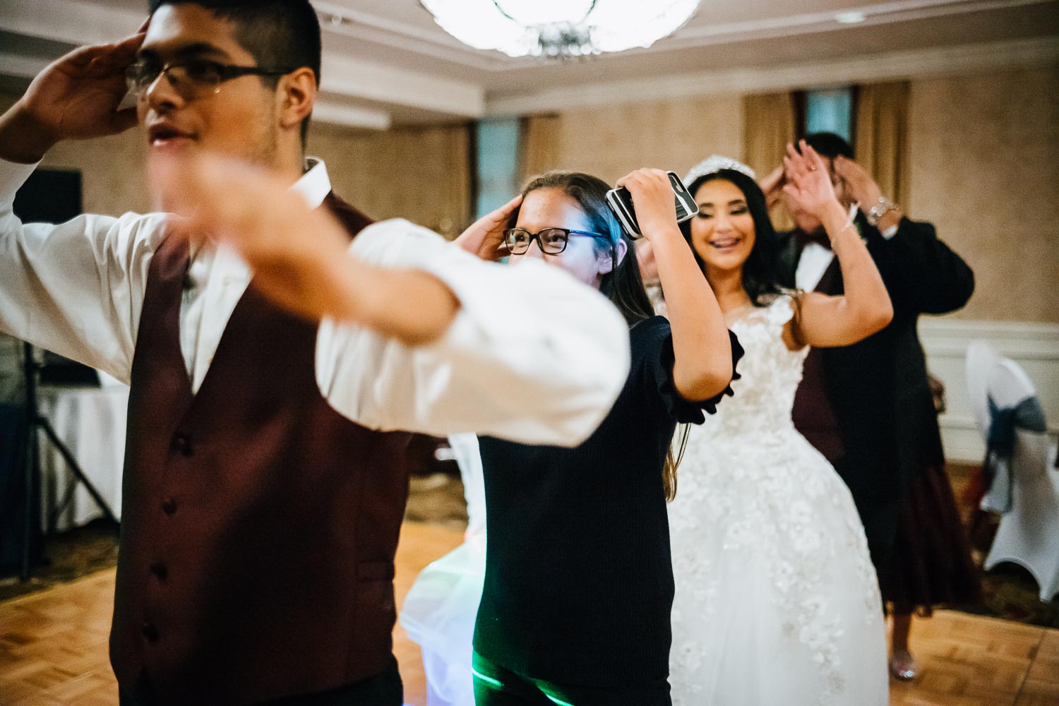 Doing the Macarena at a wedding reception