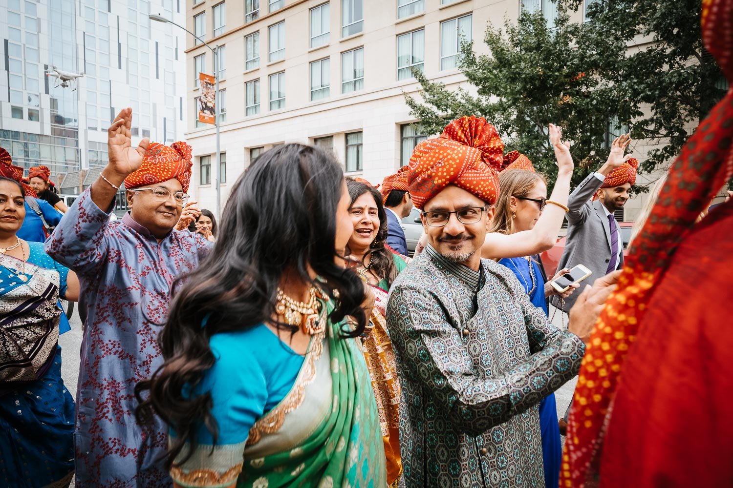 Family members party loudly on a Sunday monring at Brazos Hall Austin South Hindu asian wedding ceremony