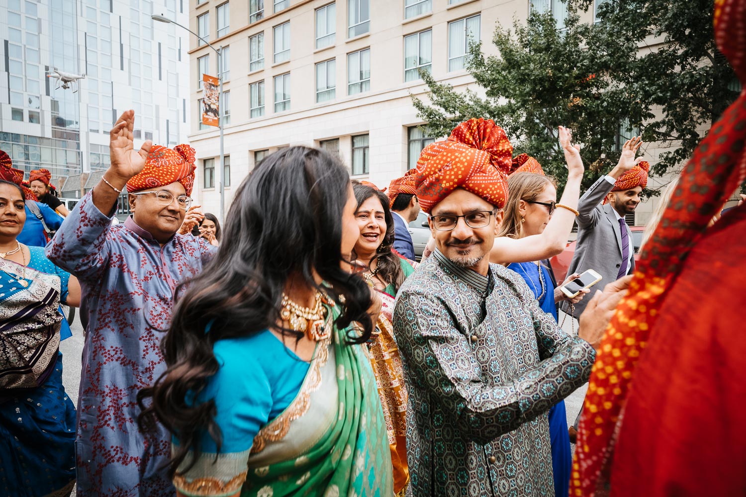 Family members party loudly on a Sunday monring at Brazos Hall Austin South Hindu asian wedding ceremony