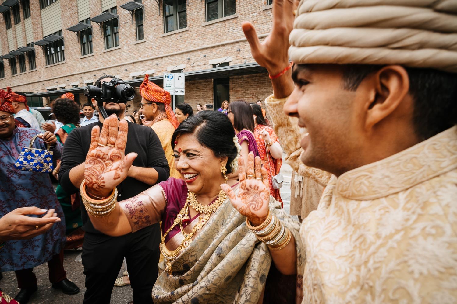 A Baraat Sunday morning with groom and mother dancing Brazos Hall Austin South Hindu asian wedding ceremony