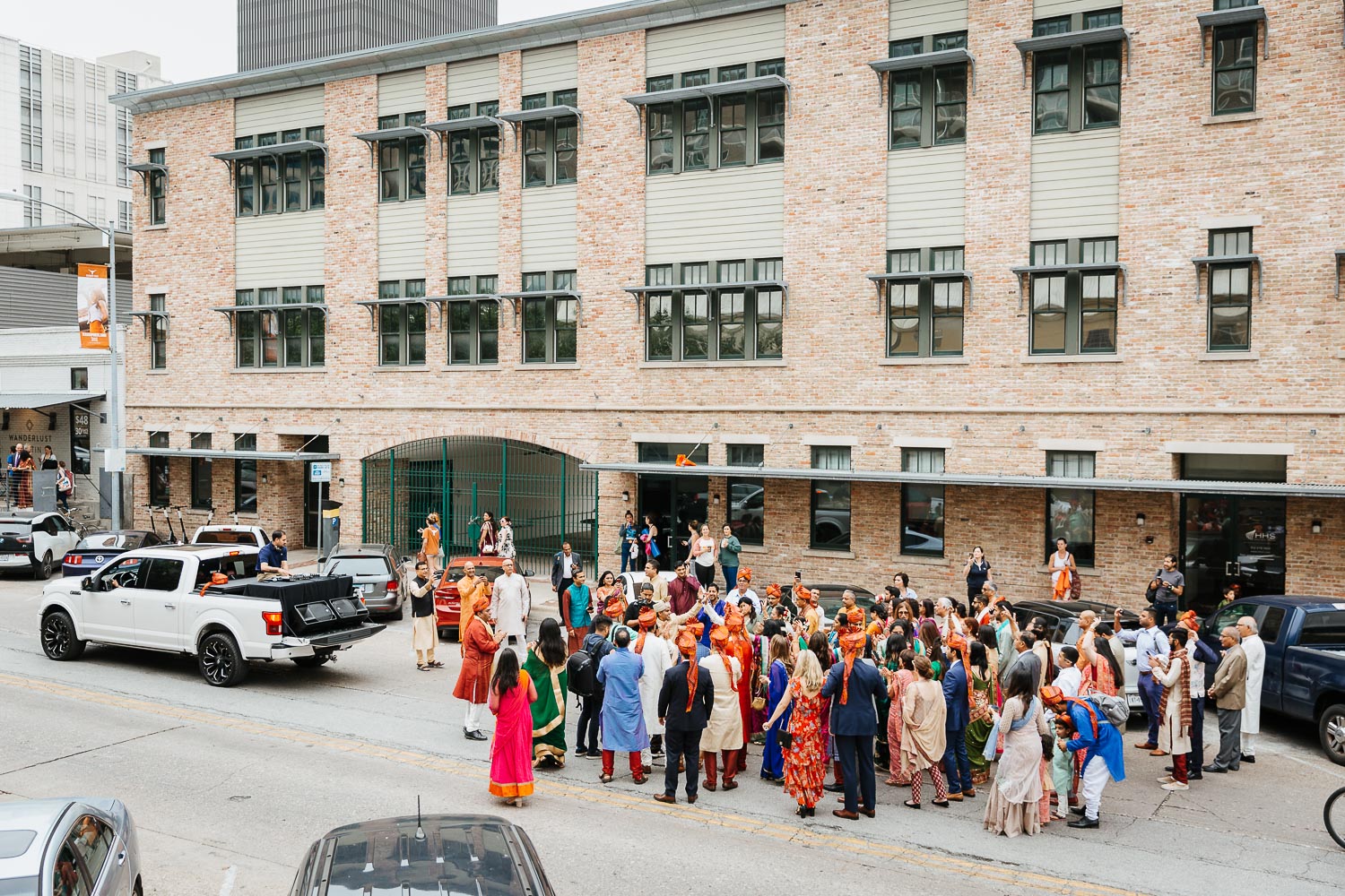 A view from across the road toward the Baraat Brazos Hall Austin South Hindu asian wedding ceremony