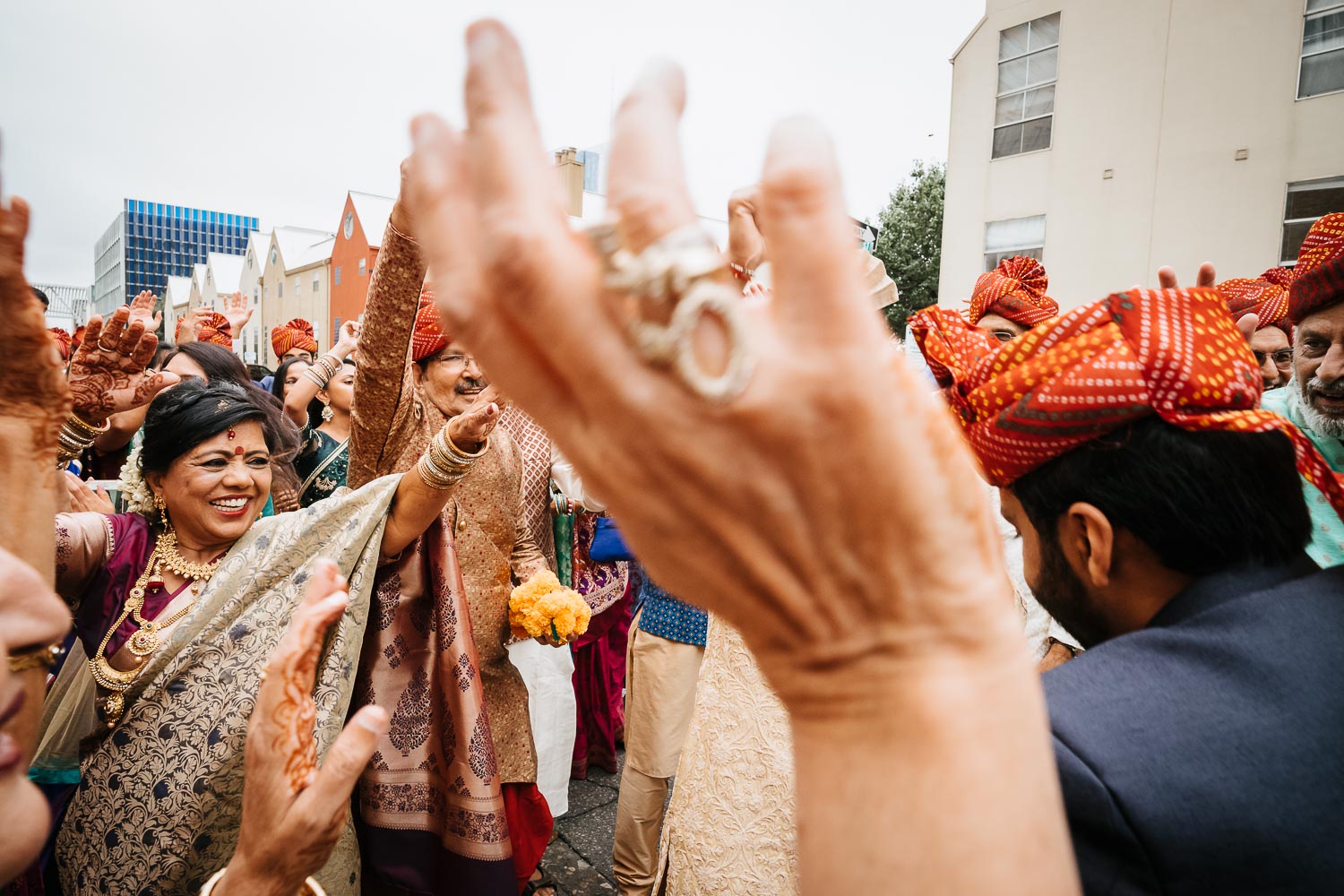 Lots of clapping during the Baraat Brazos Hall Austin South Hindu asian wedding ceremony