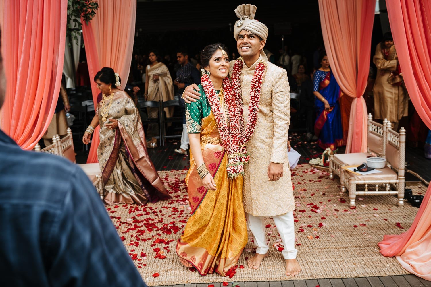 In an unposed moment, the couple take it all in at Brazos Hall Texas during their south asian Hindu ceremony