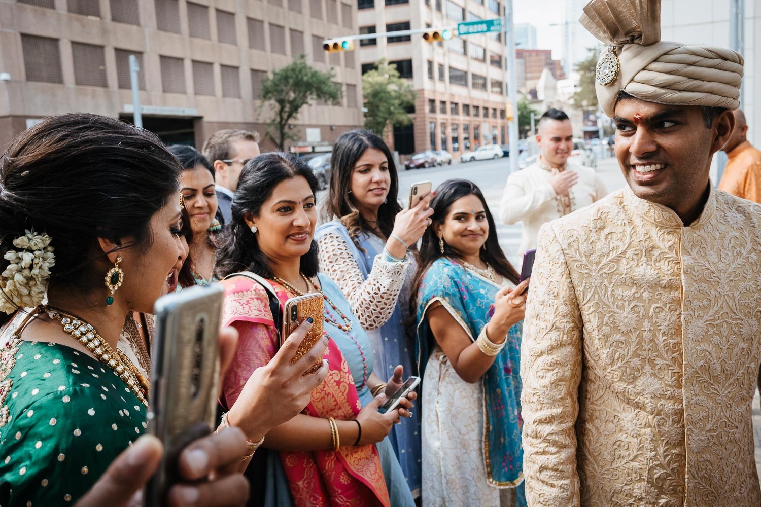 The groom leaves the wedding reception during the Vidai at Brazos Hall Austin