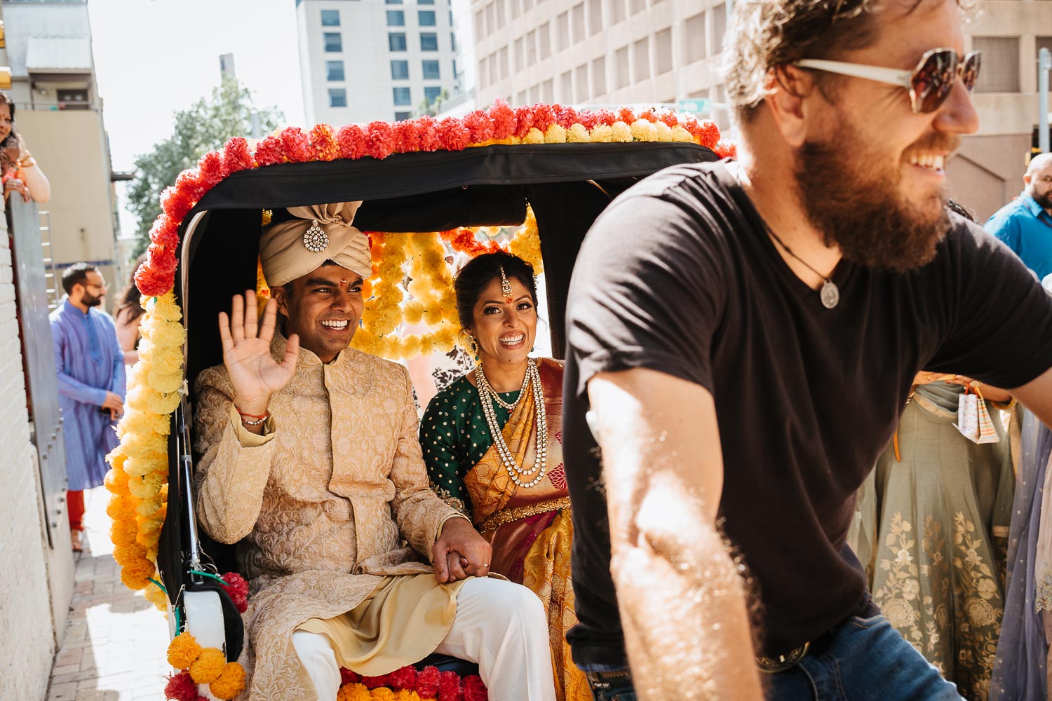 Couple leave in a Pedi Cab in Asutin downtown during the The grrom leaves the wedding reception during the Vidai at Brazos Hall Austin